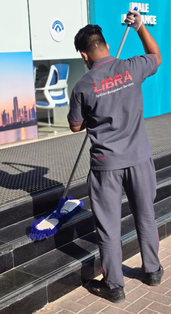 Libra Group cleaner performing professional floor cleaning service in Dubai.